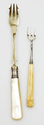 A pair of Georgian silver bright cut sugar tongs, London assay, nine EPNS fiddle pattern table forks and two pickle forks. (9) - 2