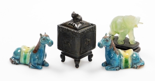 A group of Oriental ceramics, to include a miniature bronze censer with a Dog of Fo top, and dragon motifs character stamp to underside, 12cm high, a pair of glazed horses, 7.5cm high and a jade elephant on base (AF). (4)