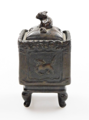 A group of Oriental ceramics, to include a miniature bronze censer with a Dog of Fo top, and dragon motifs character stamp to underside, 12cm high, a pair of glazed horses, 7.5cm high and a jade elephant on base (AF). (4) - 3