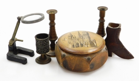 A group of various treen and effects, to include a small treen boot, 8.5cm high, a wooden trinket box depicting the cathedral, two brass candlesticks, miniature magnifying glass and a goblet. (6)