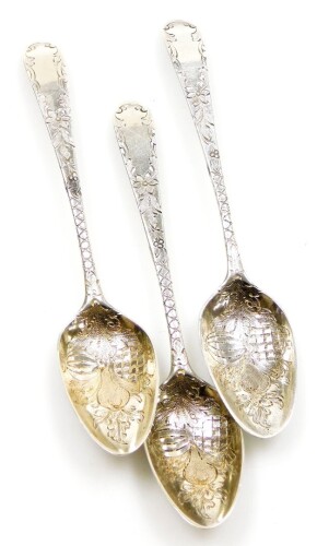 Three Georgian silver teaspoons, each chased and engraved with fruit and flowers, maker's mark TW, but heavily rubbed, 1oz.