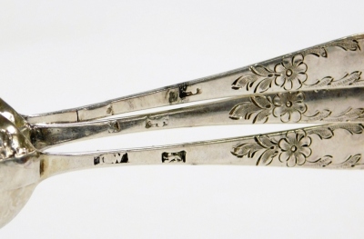 Three Georgian silver teaspoons, each chased and engraved with fruit and flowers, maker's mark TW, but heavily rubbed, 1oz. - 2