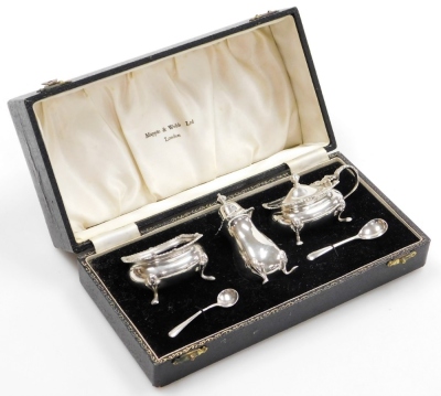 An Elizabeth II Mappin and Webb silver condiment set, two silver mustard spoons, a silver cruet with blue glass liner, silver pepper pot and silver lidded cruet with glass liner, Birmingham 1954 with one later mustard spoon dated 1969, 6oz gross. (in pre