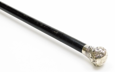 A silver topped dandy cane, the rococo scrolled and embossed top with maker's stamp HP & S, London early 19thC hallmarks rubbed, on an ebonised black cane with brass cap end, 91cm long.