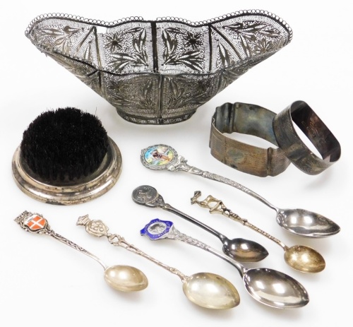 A small group of silver and effects, to include a white metal filigree bowl, a silver framed brush on weighted base, two silver napkin rings, silver souvenir spoons, and others stamped 800, weighable silver 3oz gross.