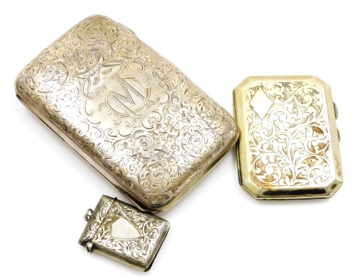 A group of silver and other cases, to include a George V silver cigar case, with heavy embossed decoration bearing the initials DM, Birmingham 1927, 14cm high, 6½oz, with a silver plated vesta case and an EPNS cigar case. (3)