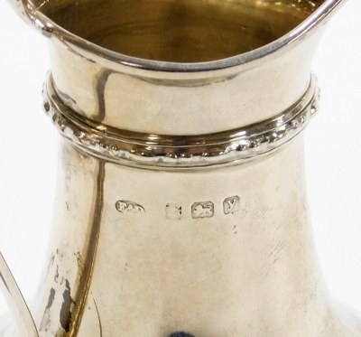 A George V silver cream jug, fluted and reeded body, on a stepped base, Birmingham 1923, 13cm high, 3¾oz. - 2