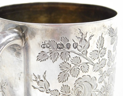 A Victorian silver tankard, with embossed floral decoration, bearing the initials JWC?, London 1890, 8cm high, 4¾oz. - 2