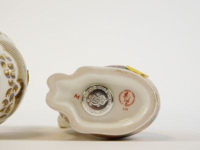 Two Royal Crown Derby paperweights, to include a cat with red stamp numbered LIX with silvered button and a seated teddy bear labelled LX11 with silvered button, 13cm and 12cm respectively. - 5