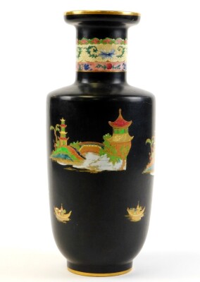 A Carlton ware Eastern style vase, on a black ground with gilt decoration painted with figures and trees in the foreground, 32cm high. - 2