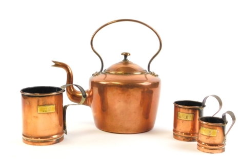 A group of copper wares, to include a copper kettle, a graduated ale three cup set the largest 13cm high the smallest 7cm high. (4)