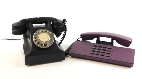 Two vintage telephones, to include a black dial telephone and a PTT Telecom purple retro telephone. (2)