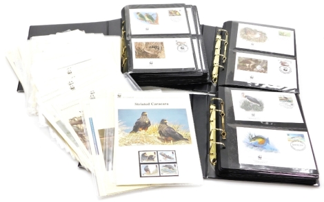 A group of WWF first day covers, contained in three black collectors albums, together with a quantity of various other first day covers from the range For a Living Planet. (3 albums and a quantity)