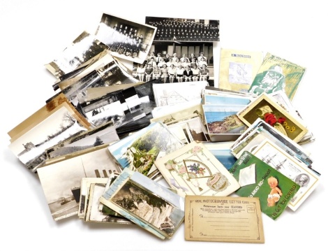 A quantity of various postcards and black and white photographs, the postcards mainly in colour of scenes on the Continent, floral studies and city scenes, the black and white photographs of landscapes, buildings and architecture. (1 box)