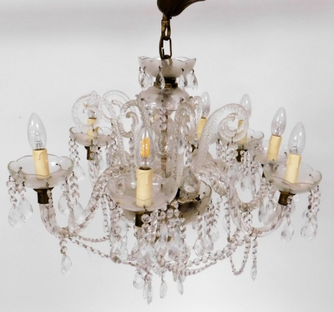 An early 20thC cut glass eight branch chandelier, with central cut glass section and various droplets, 46cm high x 55cm wide. (AF)