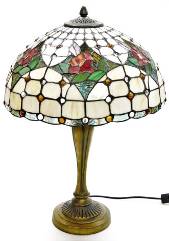 A Tiffany style table lamp, with cream rose shade, on a rubbed gilt impression base, 51cm high.