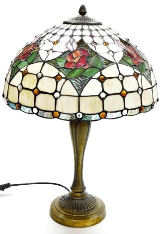 A Tiffany style table lamp, with cream rose shade, on a rubbed gilt impression base, 51cm high.