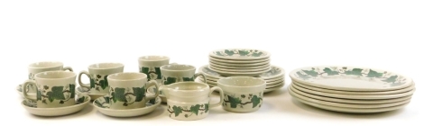 A Wedgwood Napoleon Ivy pattern part dinner service, comprising six large dinner plates, five side plates, six tea cups and saucers, six bread plates and a milk jug and sugar bowl. (a quantity)