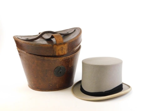 A gentleman's top hat and case, the top hat stamped Lincoln Bennett and Co Burlington Gardens Old Bond Street London, with crested initials PWA and gilt embossed internal rim, the diameter 16.5cm x 20cm, in a 19thC fitted leather case with red velvet line