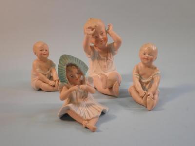 A late 19thC German Bisque porcelain "piano baby"