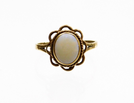 A 9ct gold opal dress ring, set with central oval opal in rub over setting, surrounded by rope twist border and pleated petal design with V splayed shoulders, ring size S, 2.7g all in.