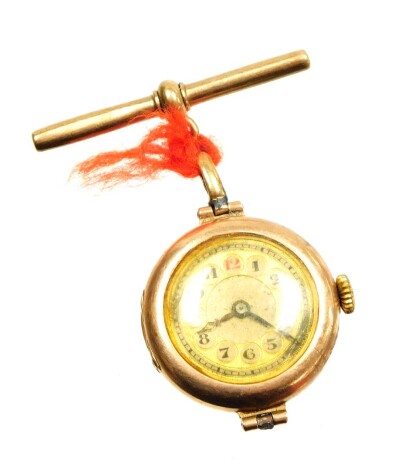 A 9ct gold cased wristwatch head converted to a nurses watch, with a 9ct gold t bar clip tied with string, 14.7g all in.