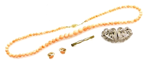 A group of costume jewellery, to include a coral beaded necklace and earring set, a bar brooch and a converted paste set buckle. (3)