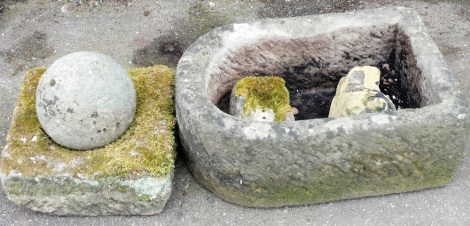 A group of reconstituted stone and other garden wares, to include a stone hewn trough, 23cm high, 62cm wide, a plinth with ball and various loose pieces. (5)