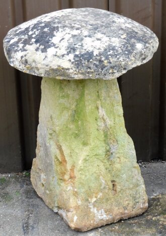 A 19thC staddle stone, with detachable mushroom top top on tapered column, 82cm high, 60cm wide.