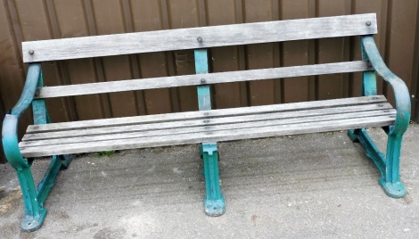 A Chattell garden bench, with green painted cast metal and wooden slats, 183cm wide, 58cm deep, 78cm high.