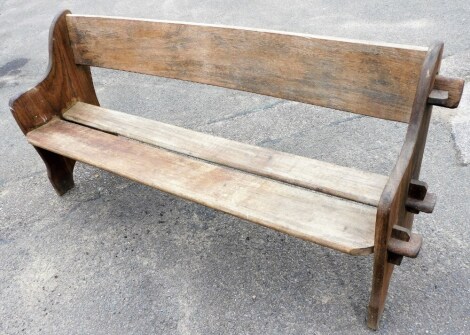 A wooden bench, with notch and slat design, 80cm high, 154cm wide, 46cm deep.