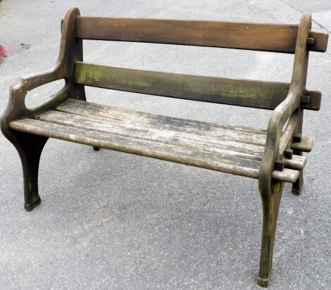 A two seater wooden garden bench, with two slat back and three slat notch base, 87cm high, 113cm wide, 49cm deep.