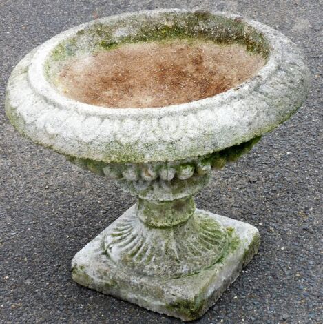 A reconstituted stone bird bath (AF), 46cm high, 48cm wide.