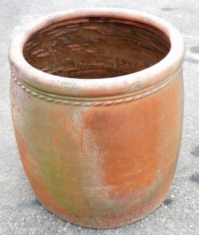 A large stoneware planter, 60cm high, 55cm wide.