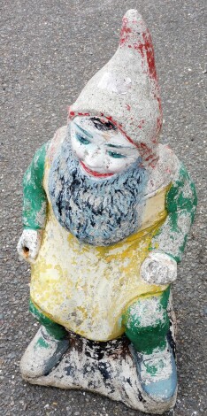 A reconstituted stone painted garden gnome, 67cm high.