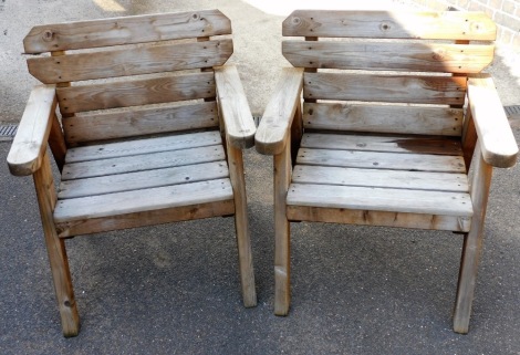 Two wooden slated single outside chairs, 107cm high, 72cm wide, 55cm deep.