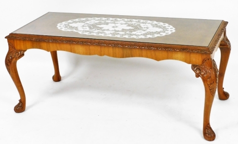 A Georgian style carved walnut coffee table, with cabriole legs and plate glass top, 50cm high, 112cm wide, 46cm deep.