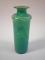 A turquoise decorated Medina style glass bottle vase