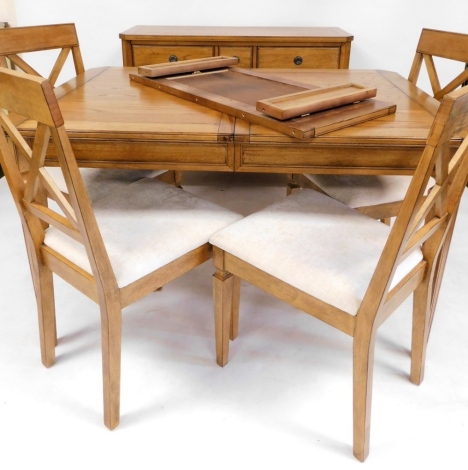 A light oak dining room suite, comprising sideboard table and chairs, the sideboard with three drawer top section above two drawers, 86cm high, 116cm wide, 46cm deep, together with a set of four oak chairs, and a table with single extending leaf, 76cm hig