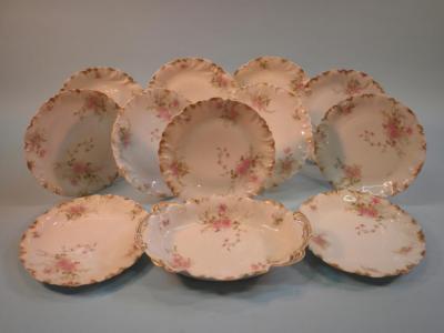 A Limoges part dessert service comprising an ovoid dish and ten plates