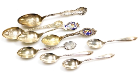 A group of various silver teaspoons and souvenir spoons, to include a set of three silver spoons, a souvenir spoon and fork, Toronto, Dolphin Club teaspoon, etc. 4½oz gross. (8)