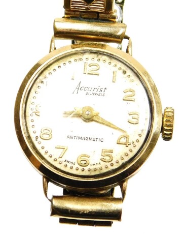 An Accurist ladies wristwatch, in a 9ct gold watch head, on an expanding gold plated strap, in a F H Weaks and Son Jewellers box.