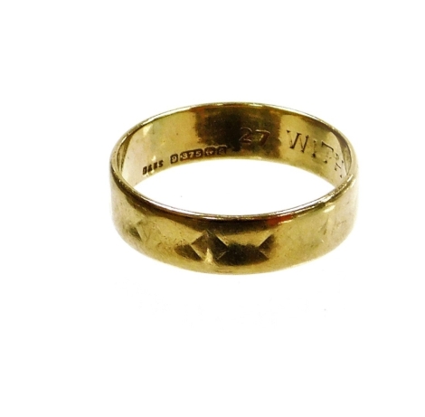 A 9ct gold wedding band, of hammered design but rubbed with engraving 'with love from Alfred', Birmingham 1990, ring size R½, 3g, boxed.