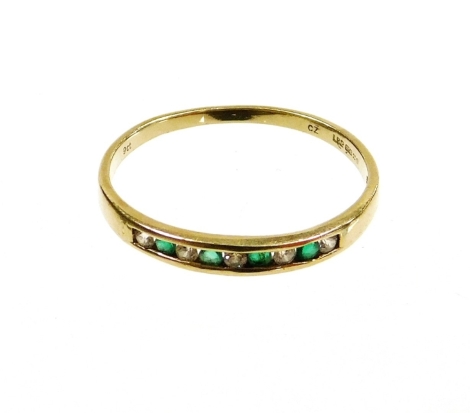 A 9ct gold half hoop eternity ring, set with CZ and green stones, ring size Q, 1.2g all in.