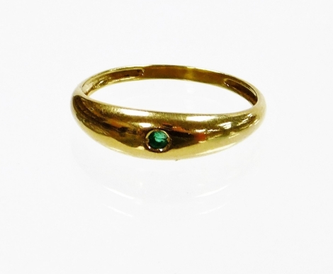 A single stone set dress ring, set with single emerald, in a yellow metal setting, stamped 750, ring size U½, 2.7g all in.