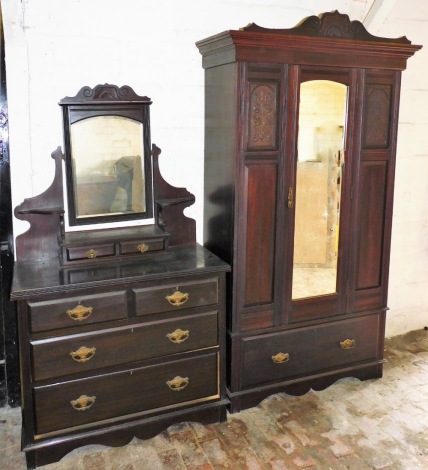 A Victorian carved mahogany bedroom suite, comprising a single door wardrobe with carved frieze and single drawer, 208cm high, 99cm wide, 42cm deep, together with a matching dressing table, with two short and two long drawers and central single mirror sec