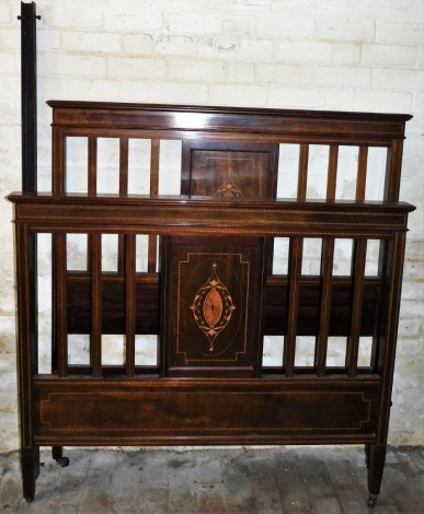 A late Victorian parquetry and marquetry inlaid mahogany double bedstead, comprising headboard, footboard and two metal supports each with marquetry inlay 152cm high, 135cm wide.