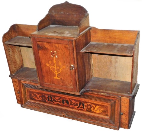 A marquetry desk stand, the top with a central cupboard section with two shelves either side above a lift up cupboard two part section with marquetry banding of figures and flowers, 80cm high, 100cm wide, 20cm deep.