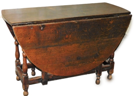 A late 17thC gate leg table, on turned legs and square framing, 70cm high, 116cm wide, 145cm diameter.