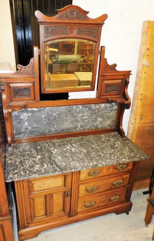 An Edwardian marble topped and figured walnut and mahogany wash stand, the mirror back top with mahogany carved finish and central mirrored panel with marble back on a grey marble top with a figured walnut base with single drawer and three drawers, on cas